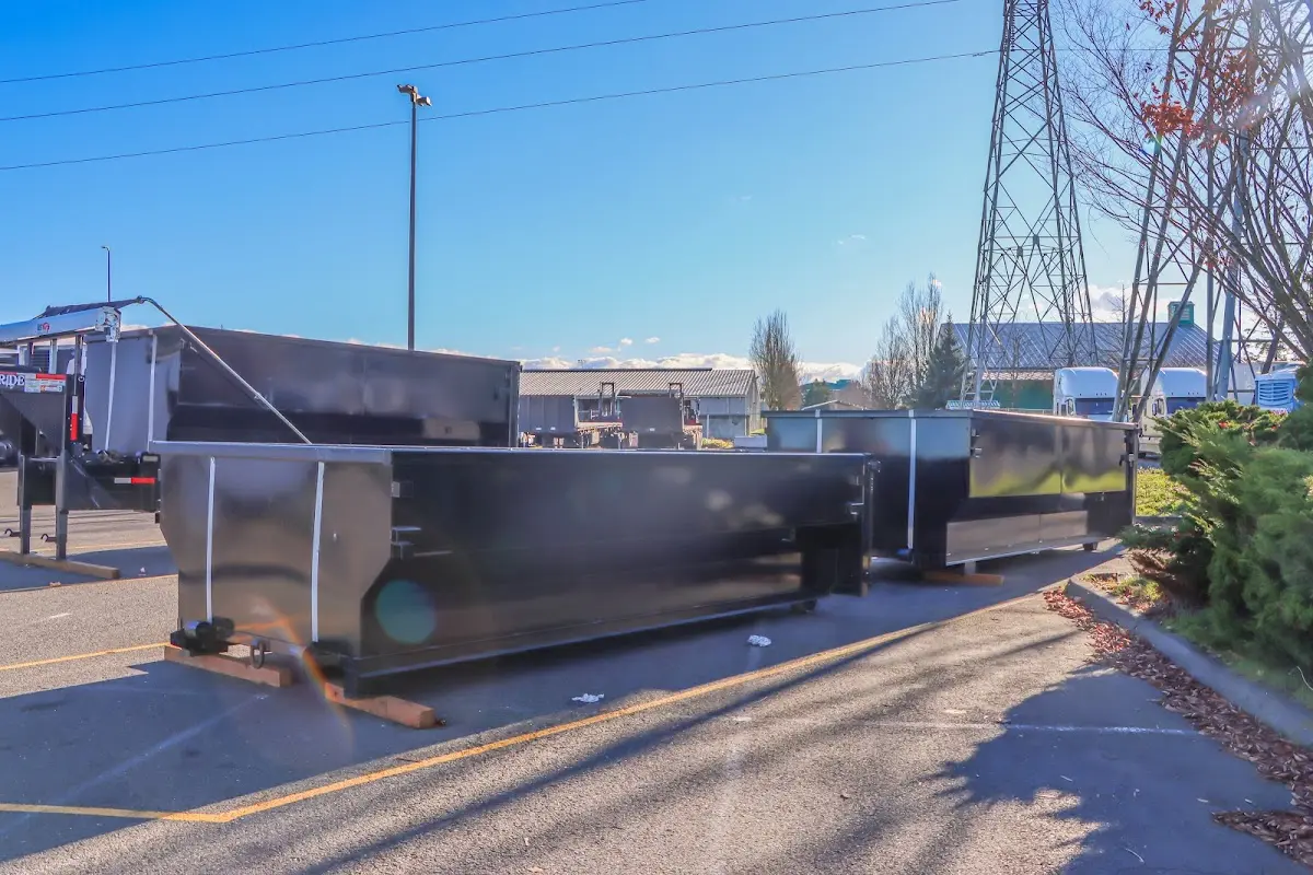 Roll-off dumpster ready for waste disposal at job site for Concrete Dumpster Rental in East Ridge